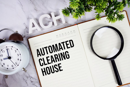 ACH - Automated Clearing House acronym on notepad, Business and Financial concept backgroundの写真素材