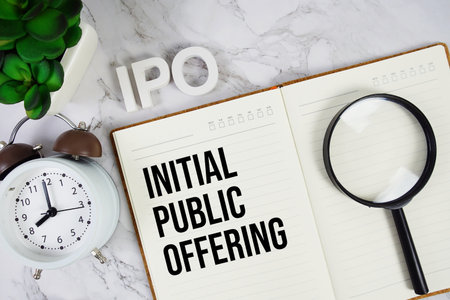 IPO - Initial Public Offering acronym on notepad, Business concept backgroundの写真素材
