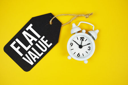Flat Value text on price tag with alarm clock on yellow background