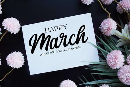 Happy March Welcome and be amazing text with flowers decorations on black backgroundの写真素材