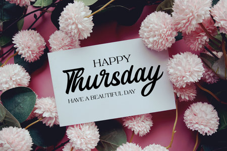 Happy Thursday Have a Beautiful Day text with flowers decorations on pink backgroundの写真素材