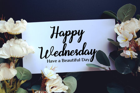 Happy Wednesday Have a Beautiful Day text with flowers decorations on black background