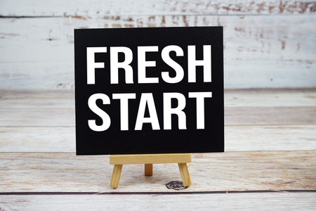 Fresh Start text with easel on wooden backgroundの写真素材