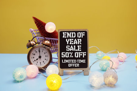End of Year Sale Promotion and Marketingwith mini trolley shopping cart and mini red pine tree
