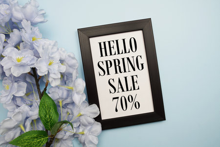 Spring Sale 70% Promotion and Marketing with flowers bouquet decoration on light blue backgroundの写真素材