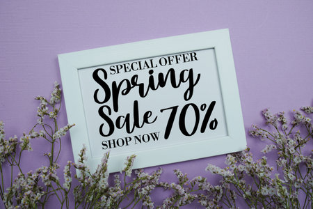 Spring Sale 70% Promotion and Marketing with flowers bouquet decoration on purple backgroundの写真素材