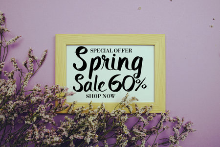 Spring Sale 60% Promotion and Marketing with flowers bouquet decoration on purple backgroundの写真素材