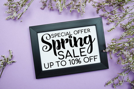 Spring Sale 10% Promotion and Marketing with flowers bouquet decoration on purple backgroundの写真素材