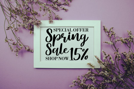 Spring Sale 15% Promotion and Marketing with flowers bouquet decoration on purple backgroundの写真素材