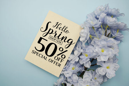 Spring Sale 50% Promotion and Marketing with flowers bouquet decoration on light blue background