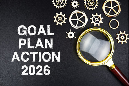 Goal, Plan Action 2026 text with magnifying glass on black background