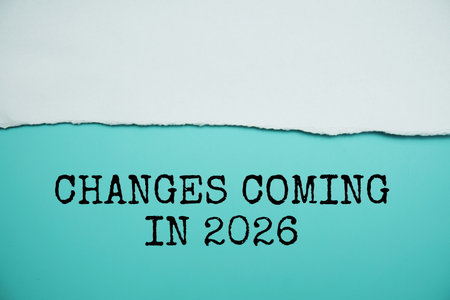 Changes Coming in 2026 text on blue background with white paper torn, New year resolutions and planning conceptの写真素材