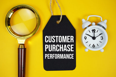 Customer Purchase Performance0 text on price tag with magnifying glass and alarm clock on yellow...