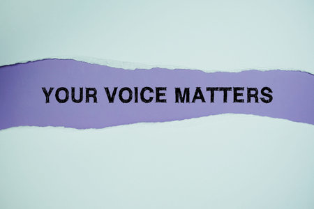 Your Voice Matters text on purple with white paper ripped of horizontal paper torn