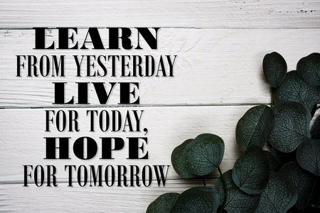 Learn From Yesterday, Live For Today, Hope For Tomorrow Motivational and Inspirational quotes on wooden backgroundの写真素材