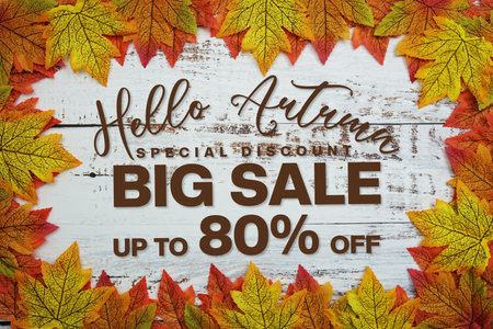 Hello Autumn Big Sale 80% with maple leaf decortaed on wooden backgroundの写真素材