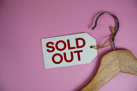 Sold Out text on price tag label with Clothes hanger Clothing Promotion shopping concept