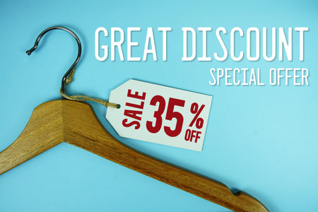 Great Discount Sale 35% off price tag label with Clothes hanger Clothing Promotion shopping concept