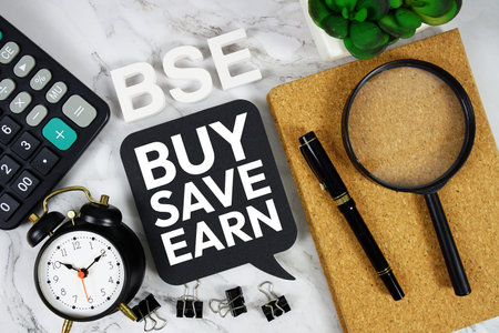 BSE - Buy, Save and Earn acronym with calculator, alarm clock and magnifying glass, Business concept...