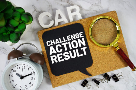 CAR - Challenge Action Result acronym with alarm clock and magnifying glass, Business concept...