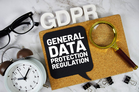 GDPR - General Data Protection Regulation acronym with alarm clock and magnifying glass, Business...
