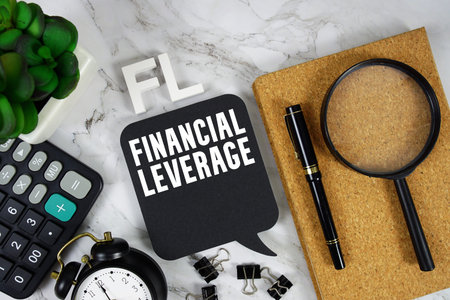 FL Financial Leverage text with Calculator, alarm clock and magnifying glass on marble background