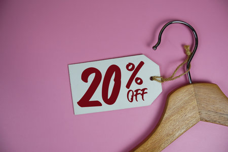 Sale 20% off price tag label with Clothes hanger Clothing Promotion shopping conceptの写真素材