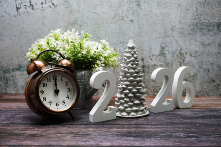 Happy New Year 2026 and Christmas Holiday Decoration on wooden background