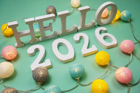 Hello 2026 alphabet letter with LED cotton balls on green background