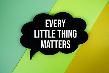 Every Little Thing Matters text on speech bubble top view on green and yellow geometric background