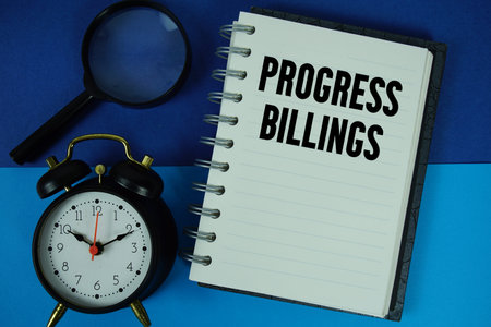 Progress Billings text written on notebook paper with alarm clock