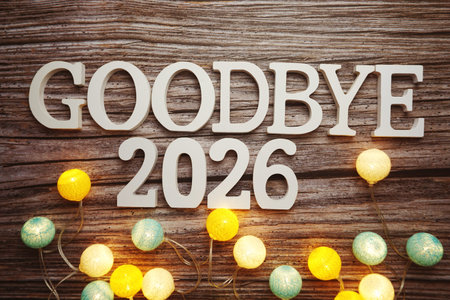 Goodbye 2026 alphabet letter with cotton ball LED decoration on wooden background