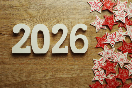 2026 Happy new year with white and red star ornament decoration on wooden background