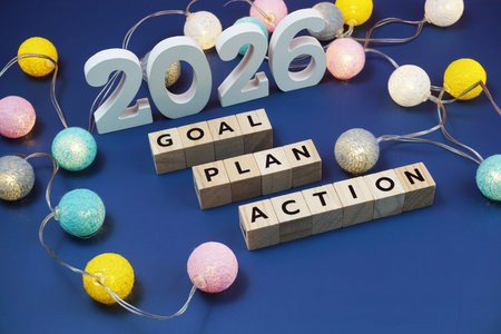 2026 Goal, Plan, Action alphabet letter decorate with LED cotton ball on blue background