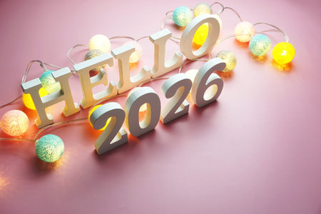 Hello 2026 alphabet letter with cotton ball LED decoration on pink background