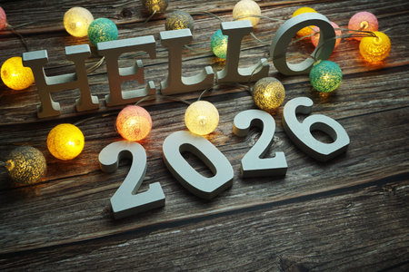 Hello 2026 alphabet letter with cotton ball LED decoration on wooden background