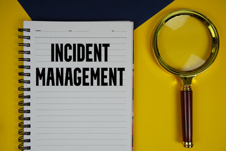 Incident Management text with magnifying glass on yellow backgroundの写真素材