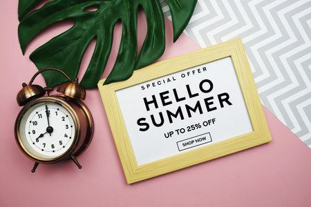 Hello Summer Sale 25% off with alarm clock and monstera green leaf on pink background