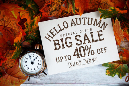 Hello Autumn Big Sale 40% off   Special Offer with maple leaf decoration on wooden background
