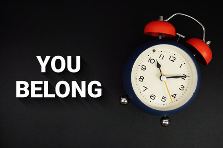 You Belong text with alarm clock on black backgroundの写真素材