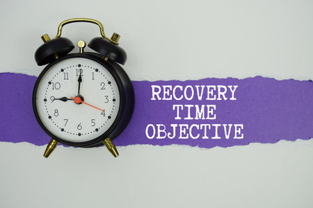 RTO Recovery Time Objective text on purple with white paper torn ripped of horizontal and alarm clockの写真素材