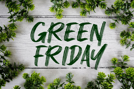 Green Friday text with artificial leaf decoration on wooden backgroundの写真素材