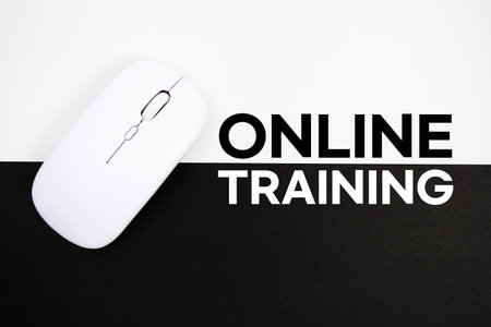 Online Training text and wireless mouse on white and black background