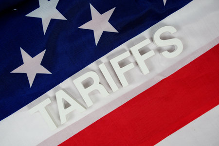 Tariffs with usa flag on wooden backgroundの写真素材