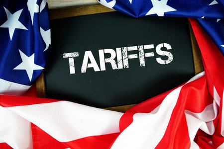 American flag with blackboard  Tariffs on wooden background
