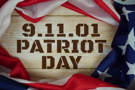 American flag with 911 Patriot Day on wooden background