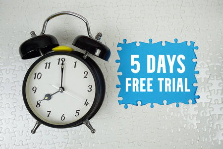 5 Days Free Trial text with alarm clock on blue backgroundの写真素材