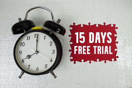 15 Days Free Trial text with alarm clock on red background