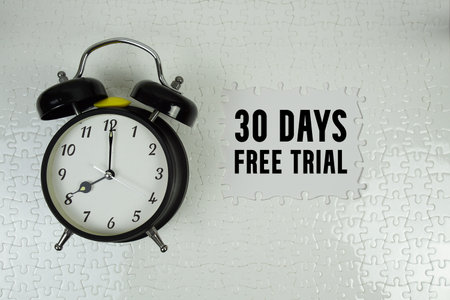 30 Days Free Trial text with alarm clock on white backgroundの写真素材