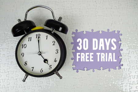 30 Days Free Trial text with alarm clock on purple backgroundの写真素材